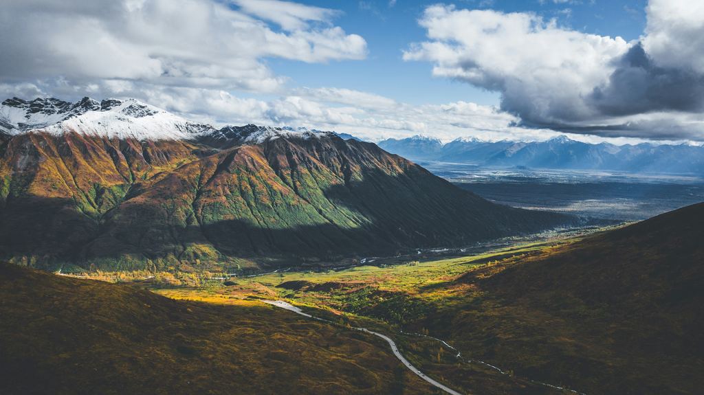Fall color in the Talkeetna Mountains above a valley in Alaska.